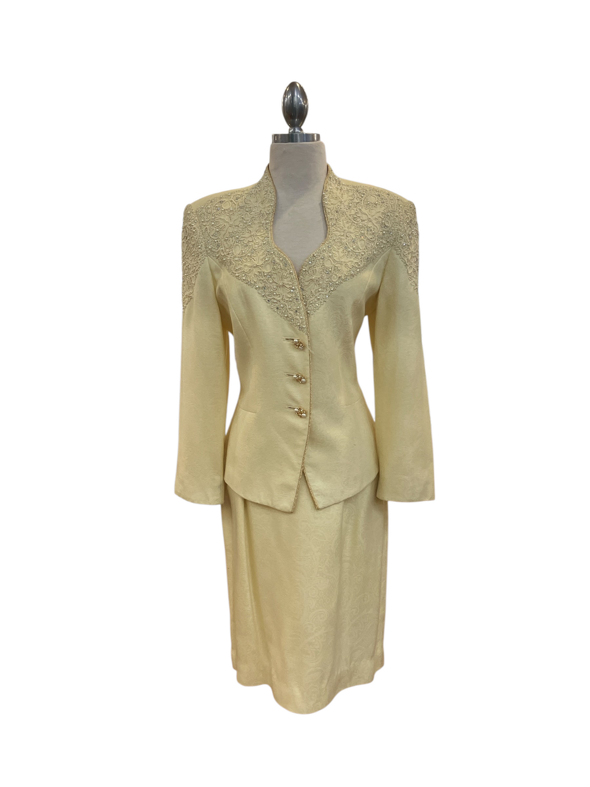 Amorin Vintage pale yellow skirt suit featuring a structured blazer with intricate tonal embroidery and gold buttons.